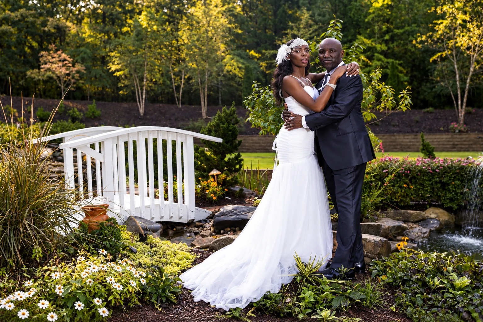 Newlyweds embracing in a formal garden