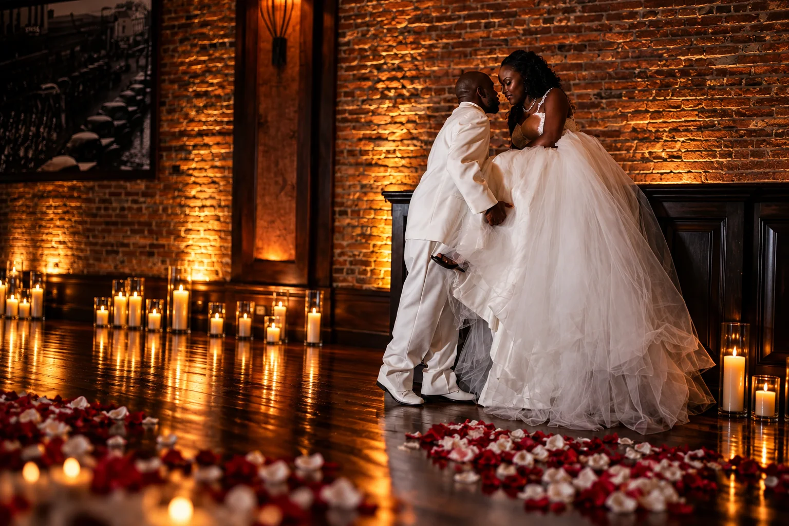Bride and groom surrounded by warm candlelight